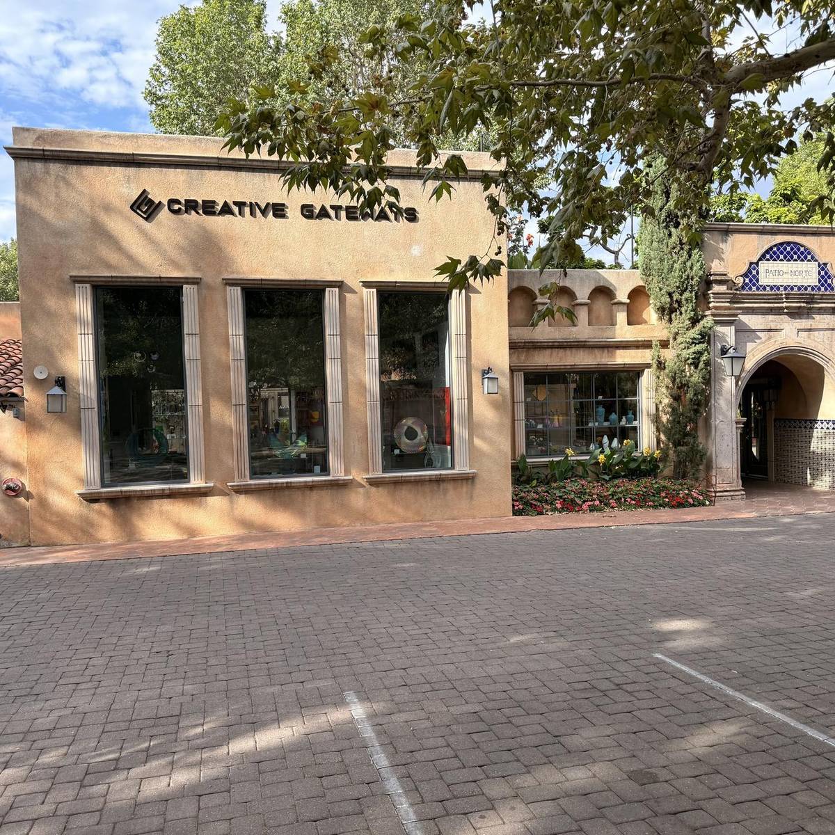 Creative Gateways Gallery storefront beside the Patio del Norte arch at Tlaquepaque Arts and Shopping Village, Sedona