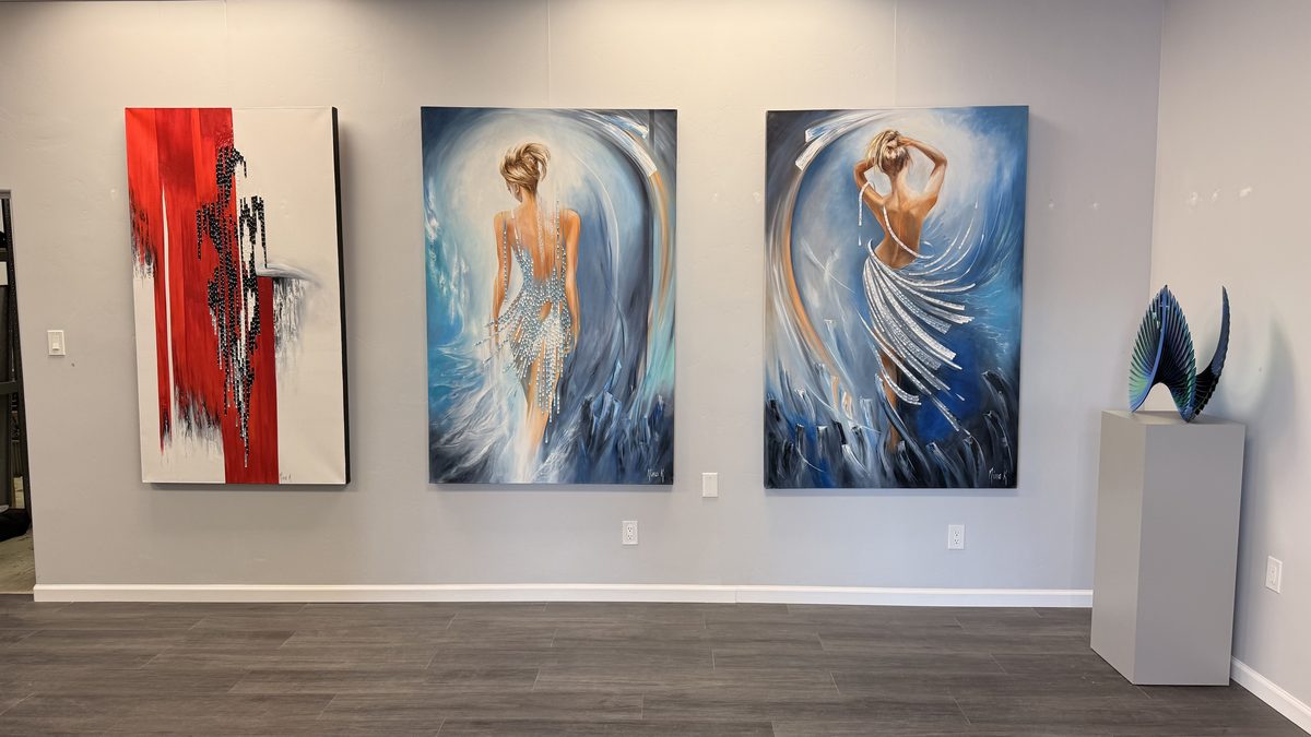 Nina K exhibition wall at the Creative Gateways Showroom: figurative and abstract oil paintings