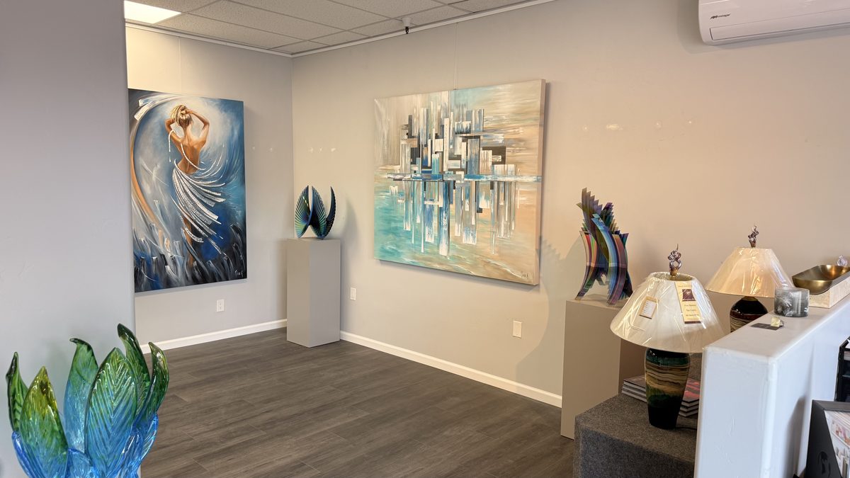 Nina K paintings with art glass sculpture inside the West Sedona Showroom
